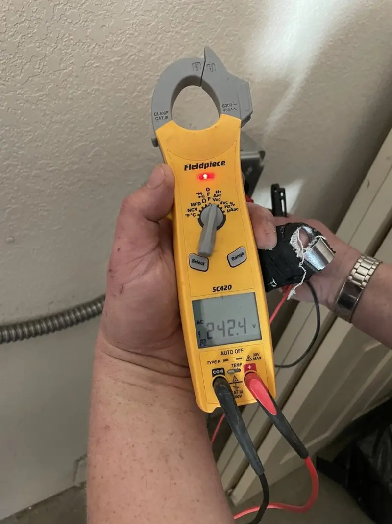 Voltage testing with clamp meter during Aluminum Wiring Replacement in Point Baker